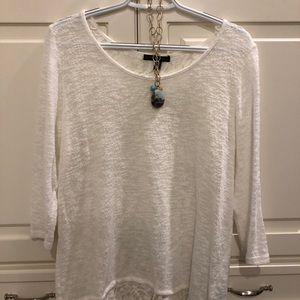 White top with lace accent and zipper in the back